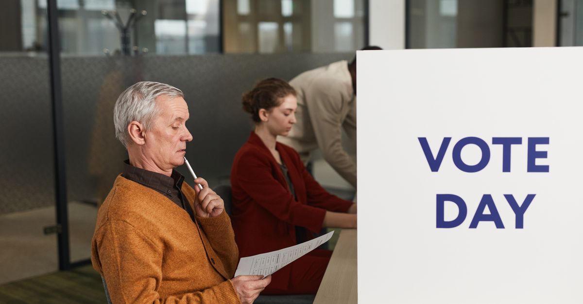 People voting indoors on election day, making decisions at a polling station.